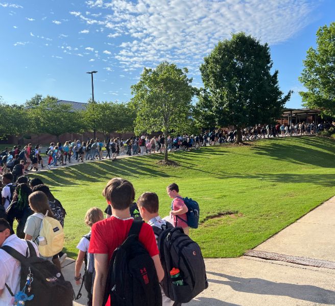  Line of students filing into Discovery Middle